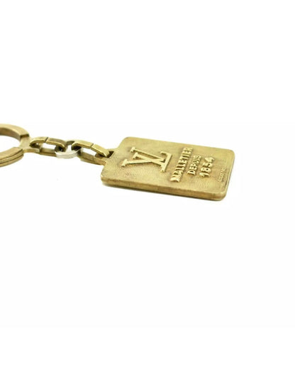 Pre-owned LOUIS VUITTON "Malletier Depuis": Brass, "LV" Logo Key Ring/Chain