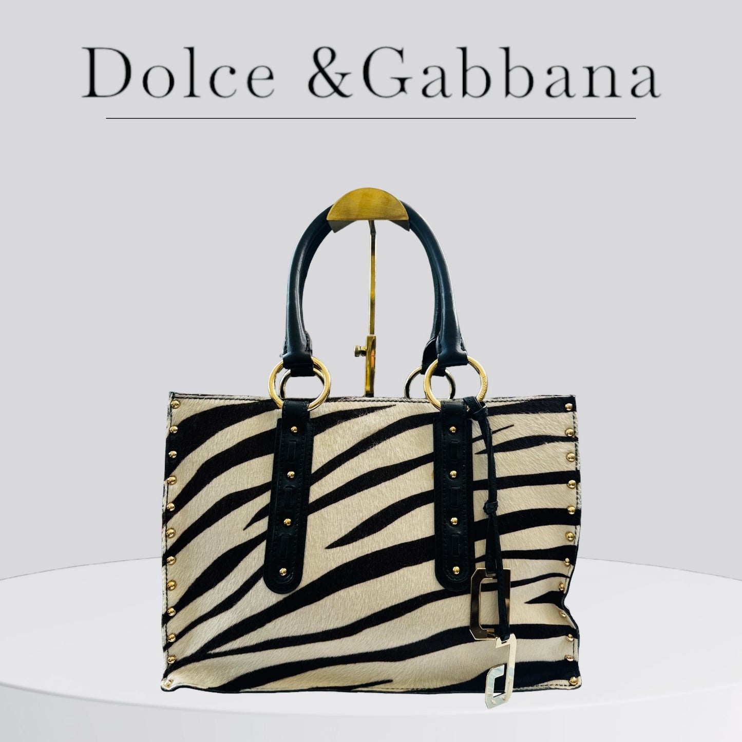 Pre-owned excellent condition A+ Dolce Gabbana handbag in studded leather, Zebra print, very good condition.