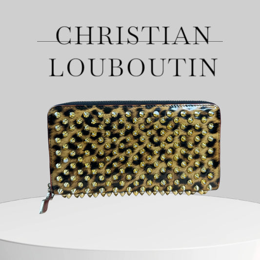 Used CHRISTIAN LOUBOUTIN 
Calfskin Panettone Spiked Zip Around Wallet Leopard