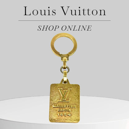 Pre-owned LOUIS VUITTON "Malletier Depuis": Brass, "LV" Logo Key Ring/Chain